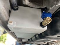 OurKaravan gray water tank install on a DIY Sprinter van